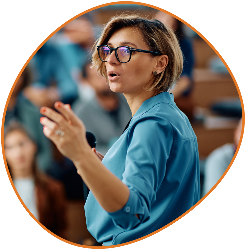 Woman speaking at a professional leadership training event. Woman speaking at a professional leadership training event.